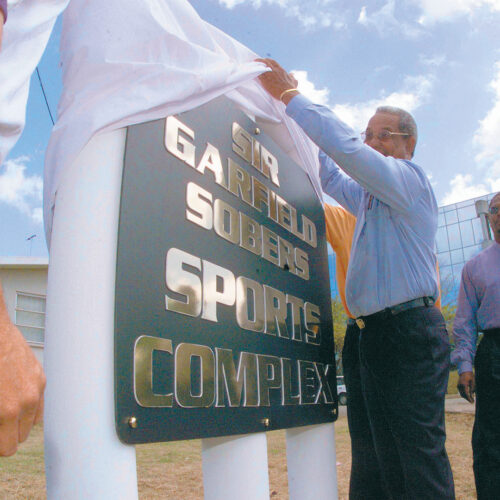 SIGNS - SIR GARFIELD SOBERS SPORTS COMPLEX Sir Garfield Sobers unveiling the first of two signs marking the entry points to the sports complex.